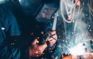 worker welding and fabricating