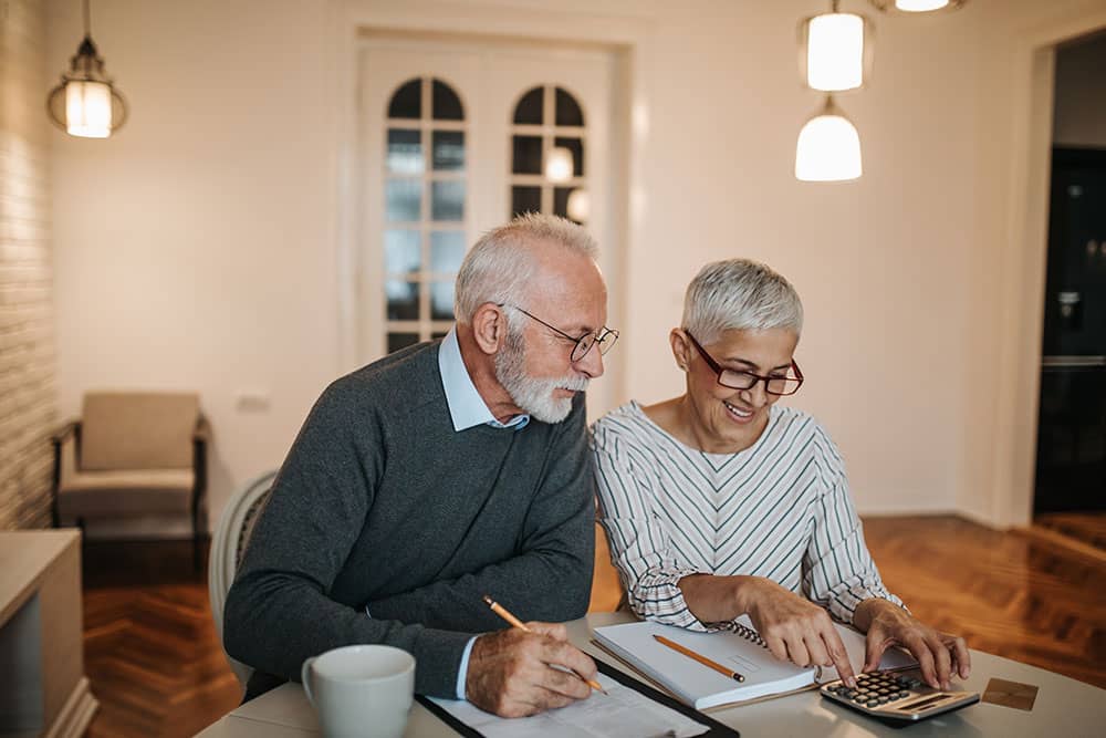 couple looking to retire checking their insurance