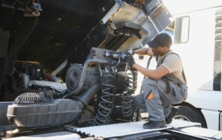 Mechanic working on diesel engine